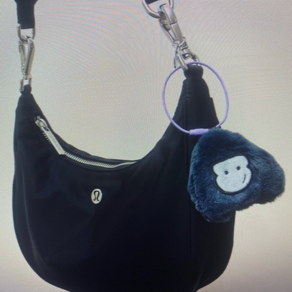 lululemon athletica Handbags - Lululemon Athletica Black Backpack with Plush Charm